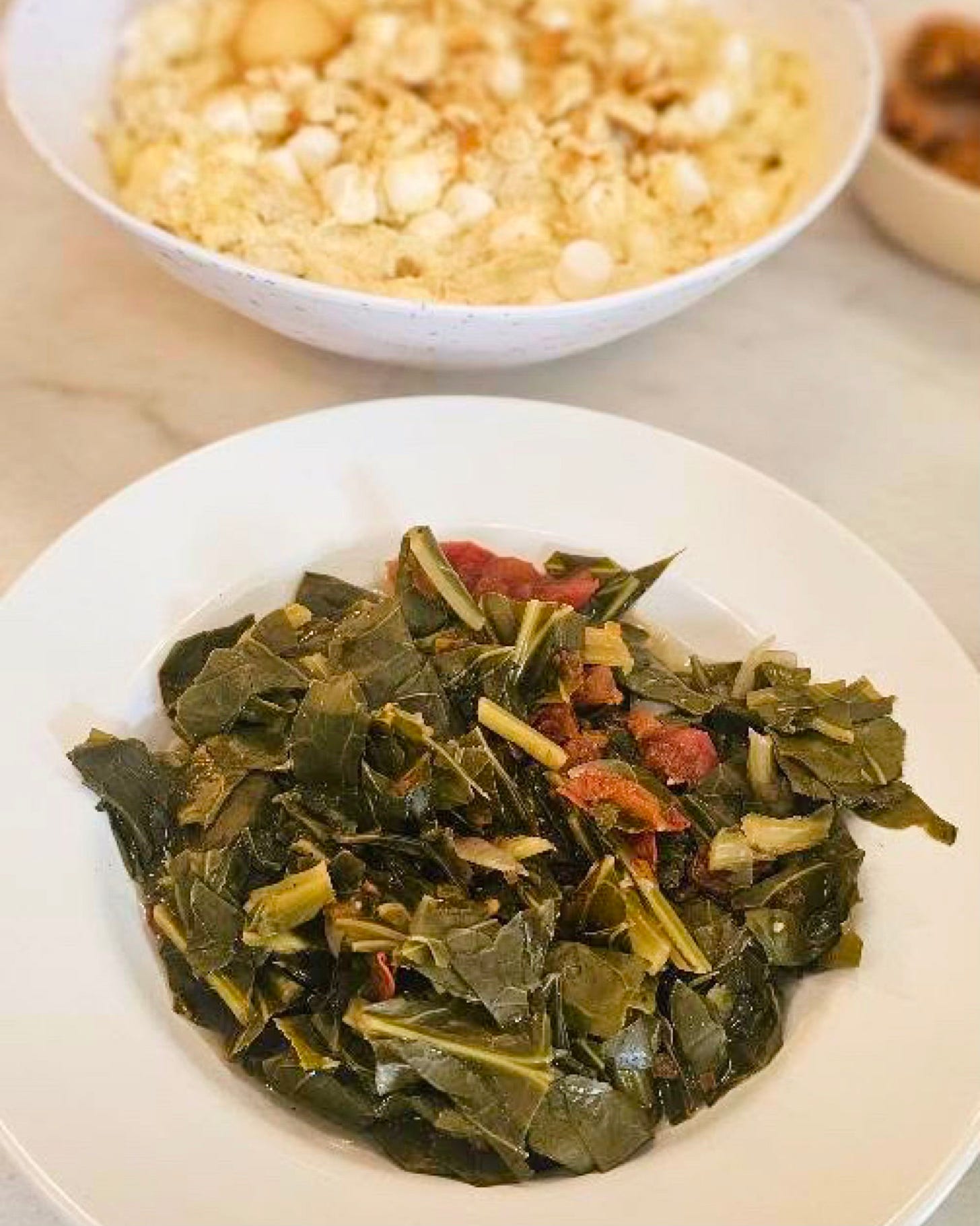 Southern collard greens cooked with traditional seasoning, representing African American food heritage and cultural cooking practices