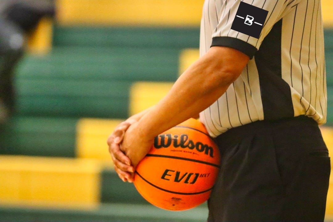 man in white shirt holding basketball man in white shirt holding basketball