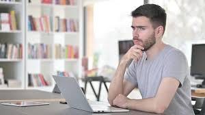 Pensive Young Man Thinking New Plan in ...