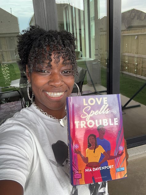 Gallery of pictures of "Love Spells Trouble," Nia, readers, and the books characters