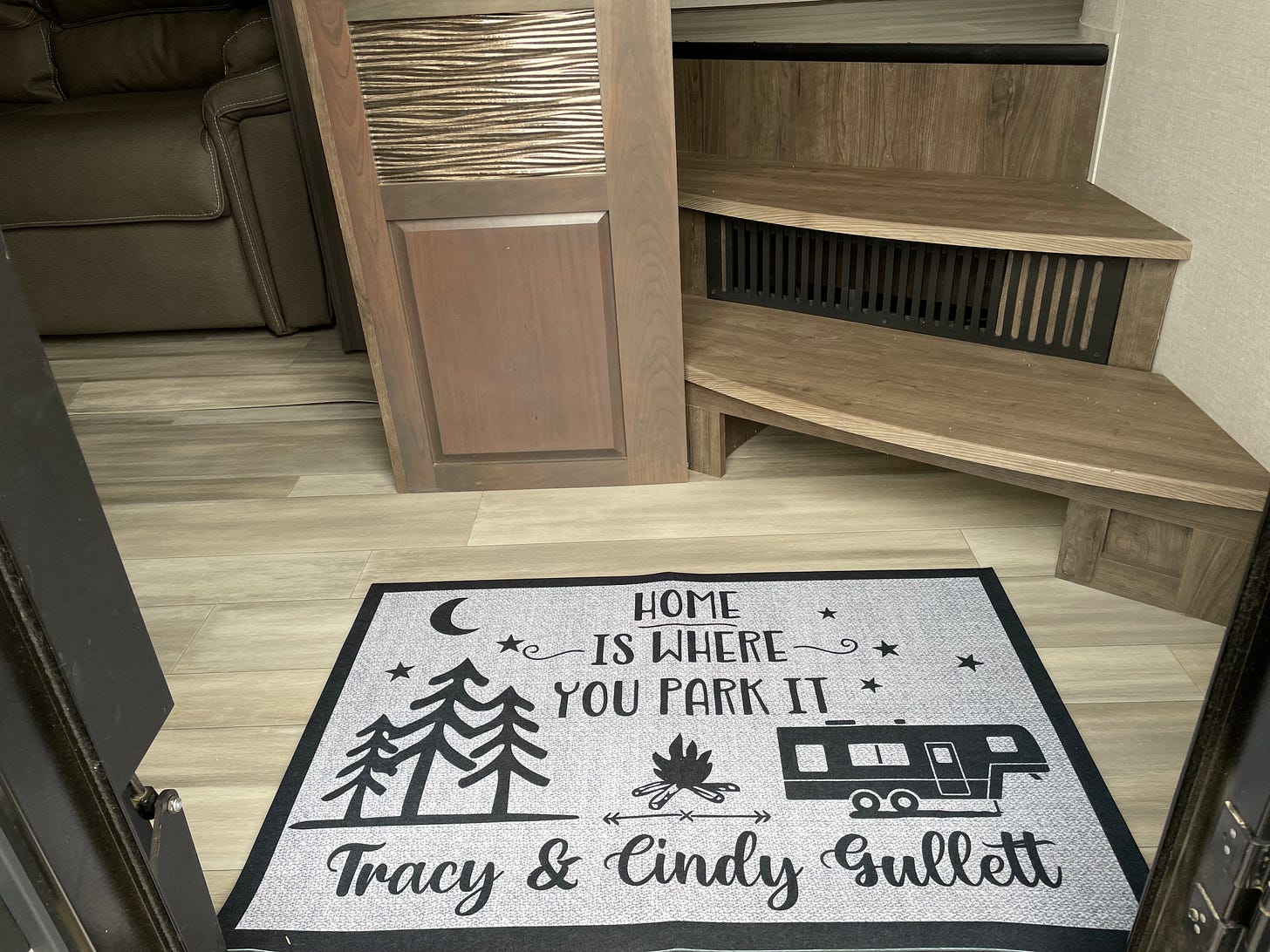Welcome mat saying "Home is where you park it"