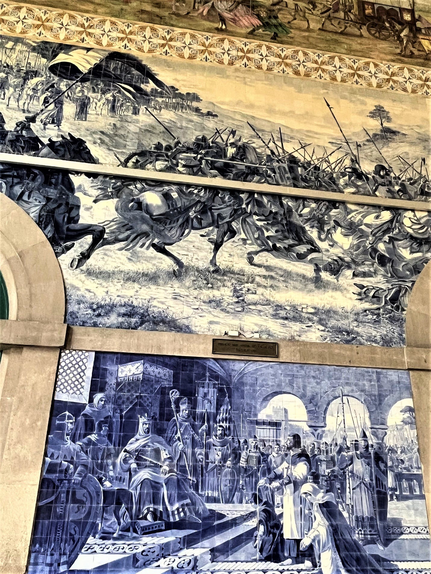 A wall with a painting of soldiers and horses

Description automatically generated