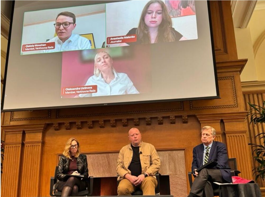 A group of people sitting in chairs

AI-generated content may be incorrect.