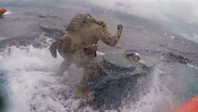 Dramatic video shows Coast Guard leaping onto submarine carrying ... Dramatic video shows Coast Guard leaping onto submarine carrying ...