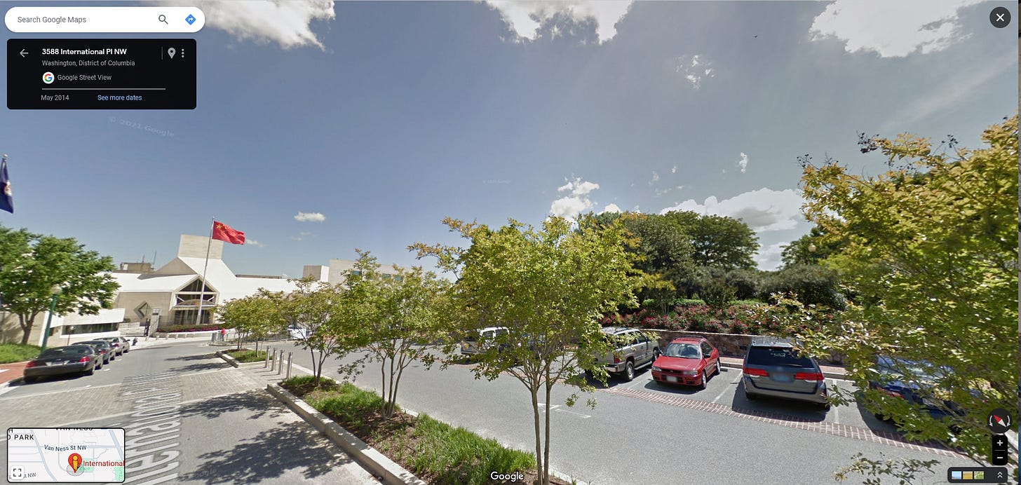 Another Google Street View image showing the gate with the Chinese flag flying out front.