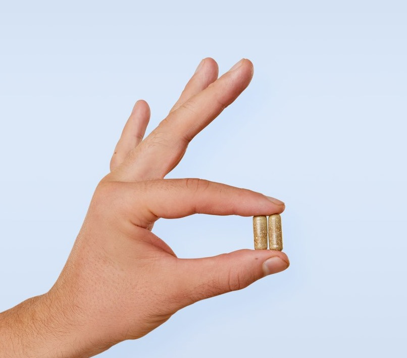 A person's hand with a ring on it