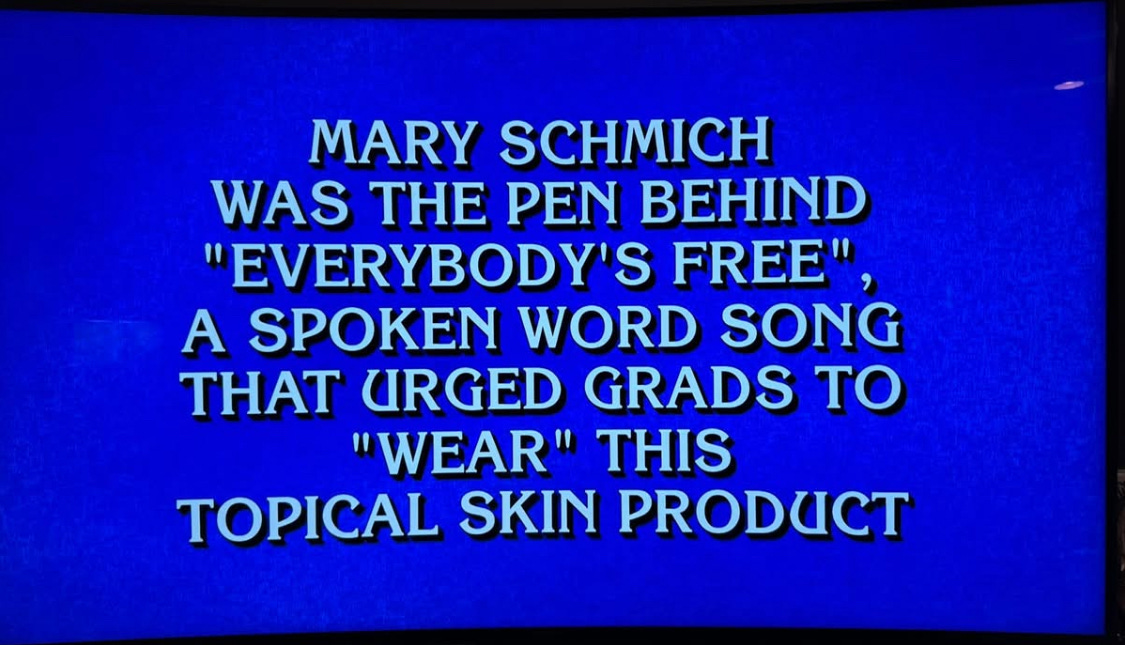 May be an image of television and text that says 'MARY SCHMICH WAS THE PEN BEHIND "EVERYBODY'S FREE" A SPOKEN WORD SONG THAT URGED GRADS TO "WEAR" THIS TOPICAL SKIN PRODUCT'