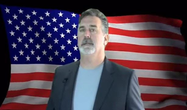 Dave Landry In Front Of American Flag