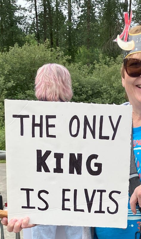 Signs at Bothell No Kings Rally