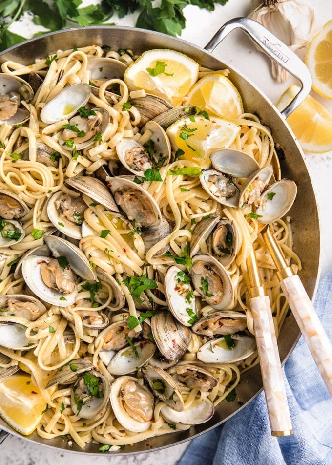 overhead of linguine with clams in a stainless steel pan overhead of linguine with clams in a stainless steel pan