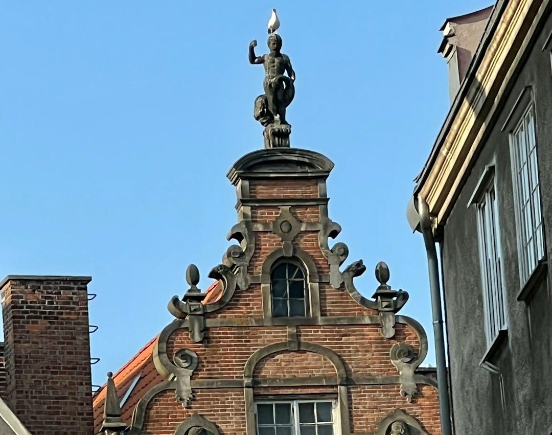 a statue on top of a building a statue on top of a building