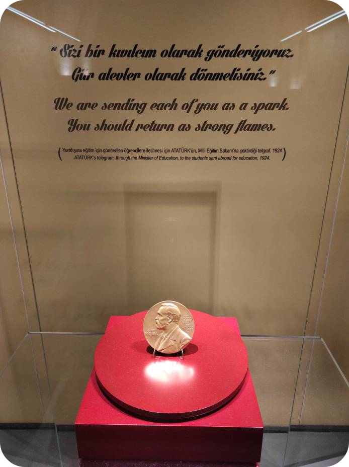 Top view of Turkey at night, selfie of our team that visited METU, Devrim at METU, and the Nobel Prize that Aziz Sancar gifted to Anitkabir