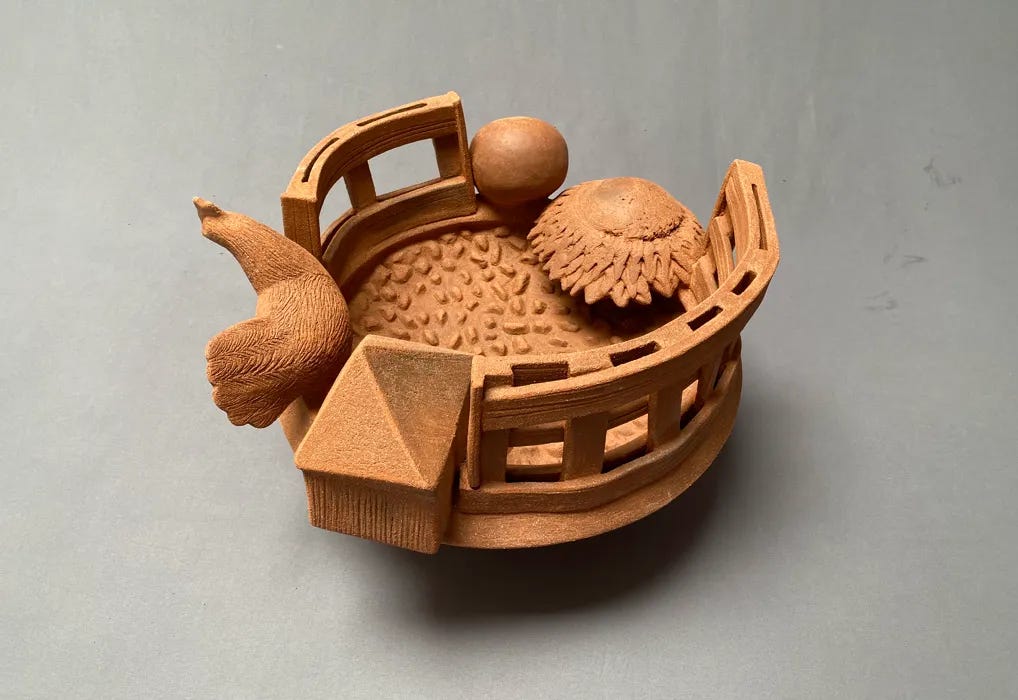 Handmade sculpture in natural clay, featuring a chicken, sunflower, egg, and fence in a circular arrangement.