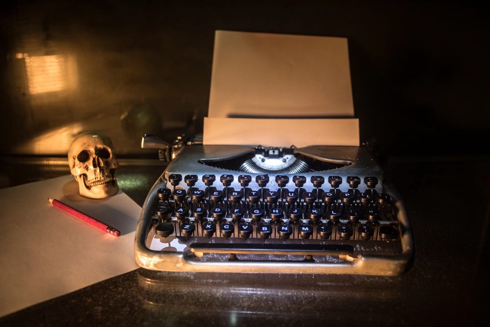 Obituaries - typewriter and skull