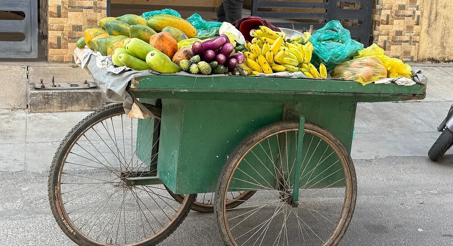 Fruits and vegetables on a large wooden cart