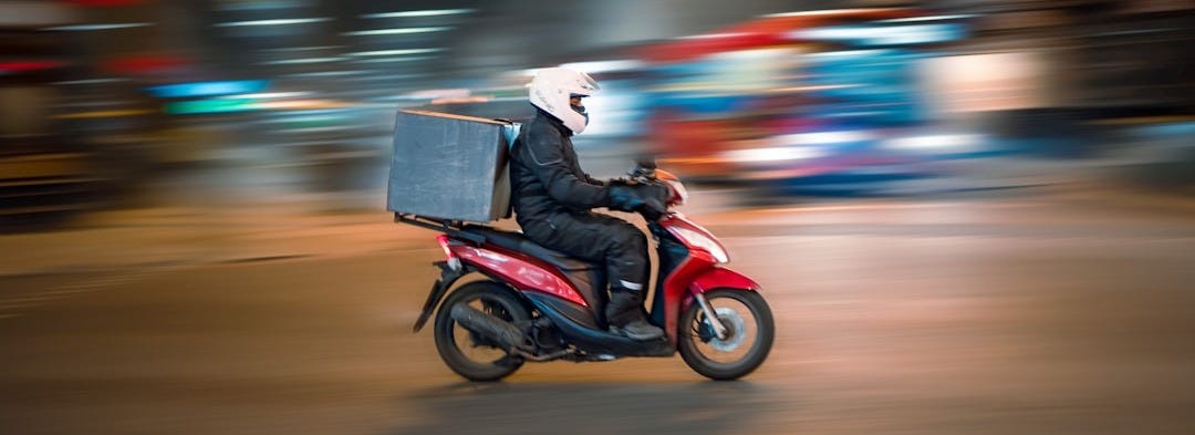 man riding motorcycle on road during daytime