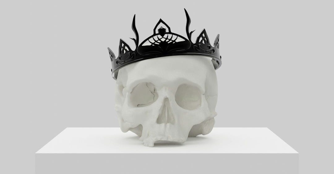 a skull with a crown on top of it a skull with a crown on top of it