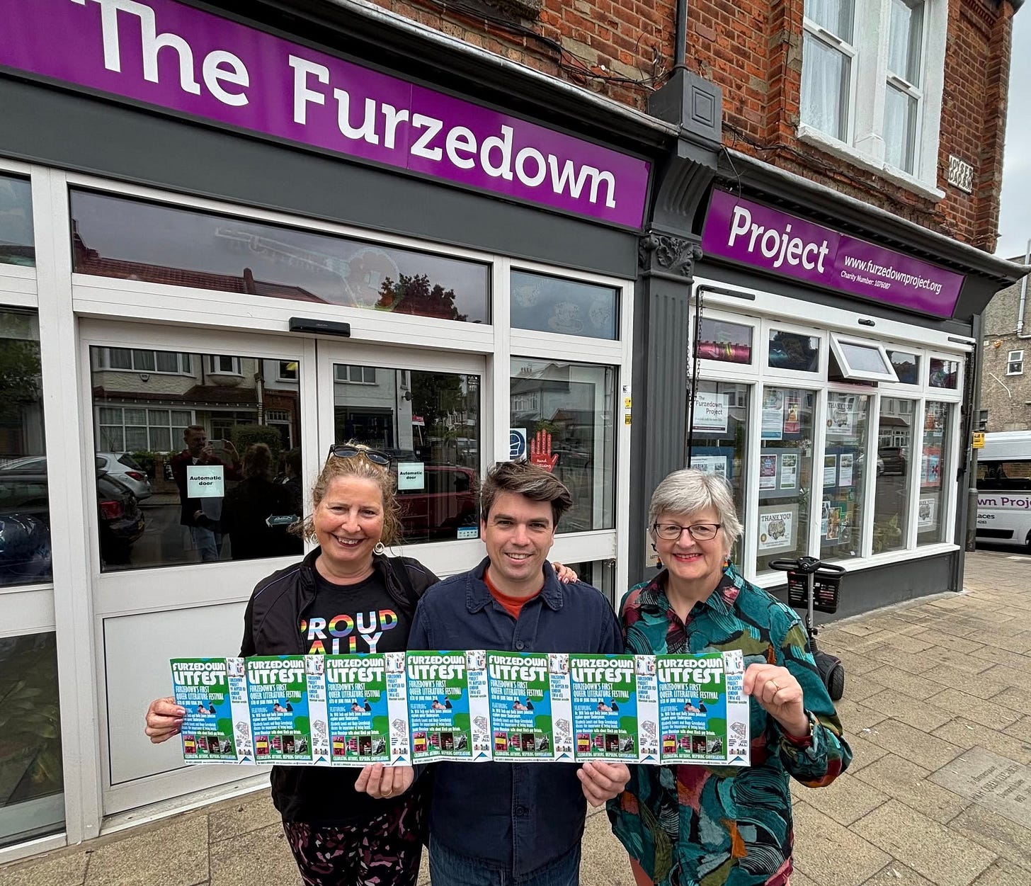 May be an image of 3 people and text