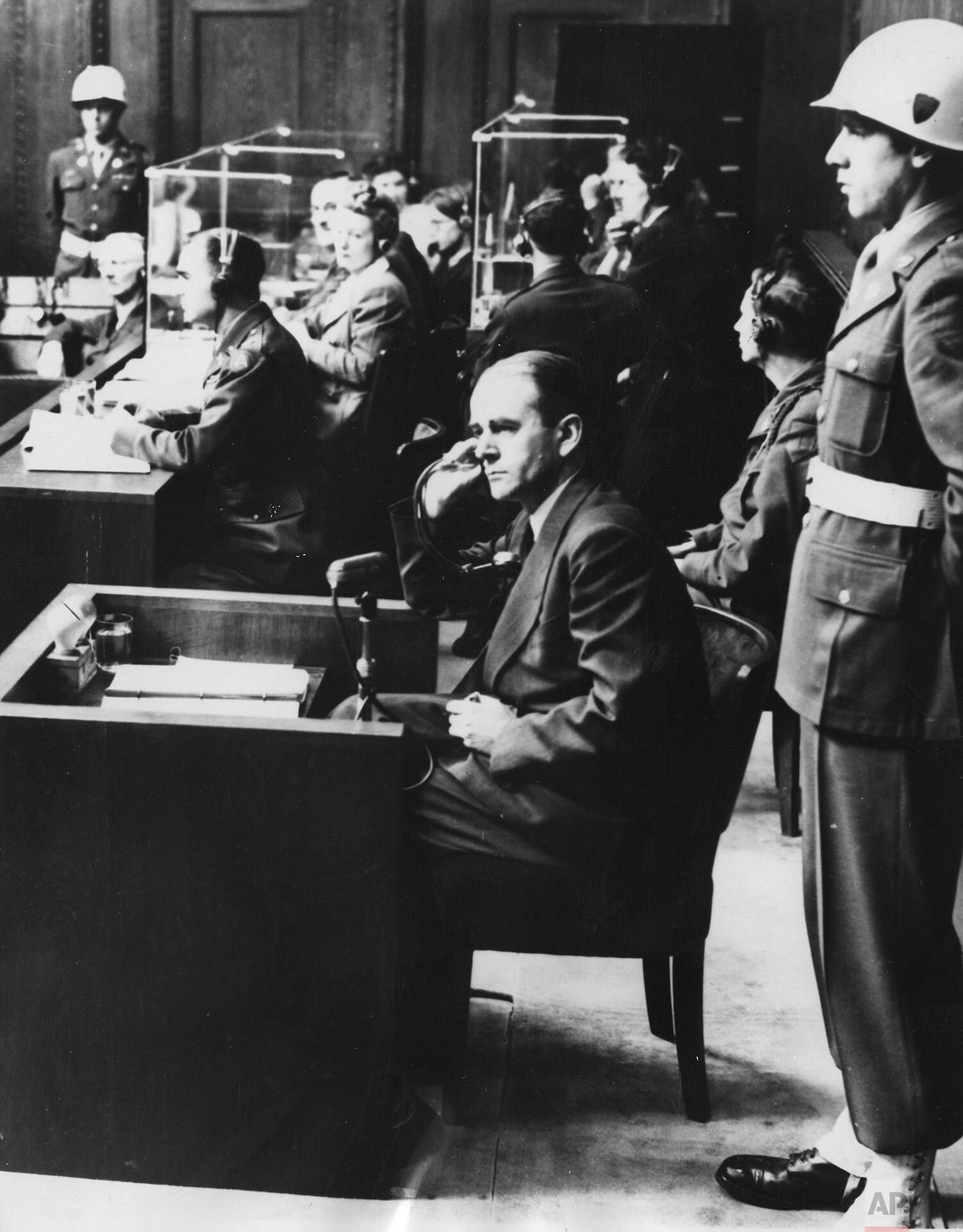 Albert Speer, Hitler's former architect and Armaments Minister, pictured in court during his war crimes trial at Nuremberg on September 12, 1946, facing accountability for his pivotal role in the Nazi regime. Albert Speer, Hitler's former architect and Armaments Minister, pictured in court during his war crimes trial at Nuremberg on September 12, 1946, facing accountability for his pivotal role in the Nazi regime.