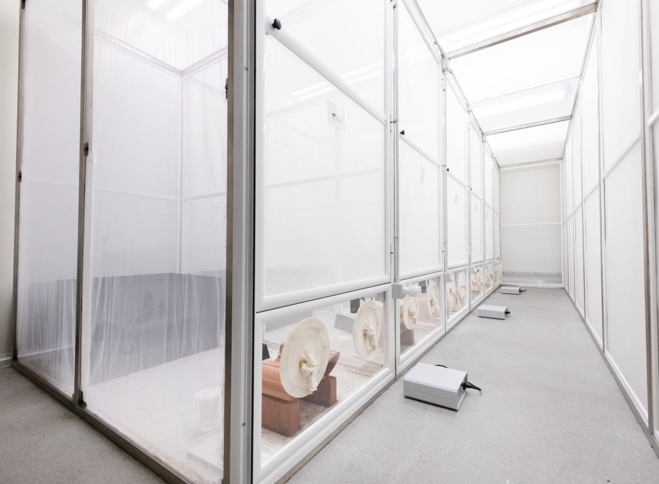 A row of mesh cages