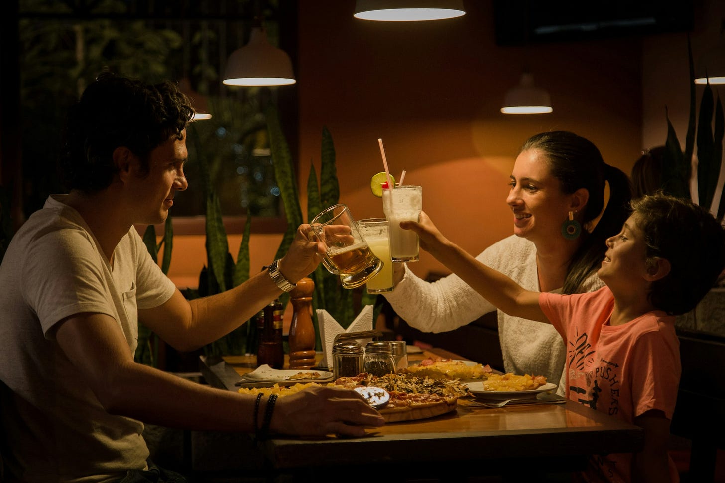 three people having a toast on table three people having a toast on table