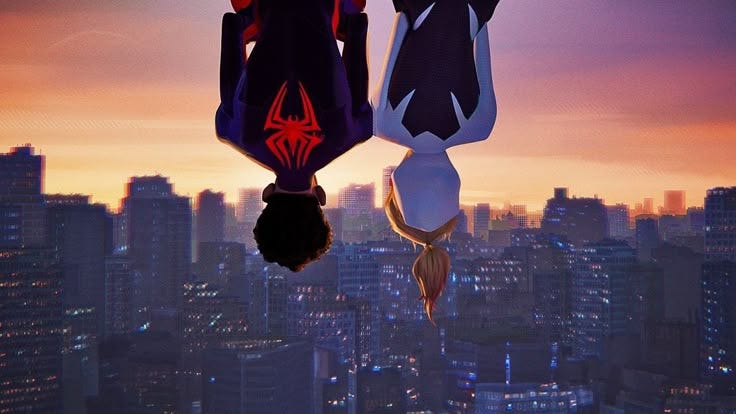 This may contain: two spider - man hanging upside down in front of a cityscape at sunset