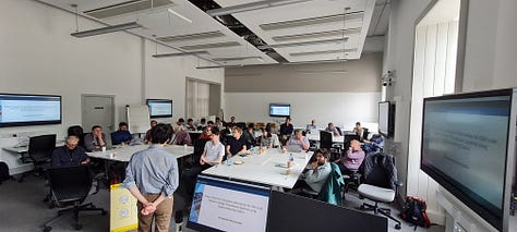Five photographs of workshop attendees around tables in discussion, and a collage of speakers in front of presentations