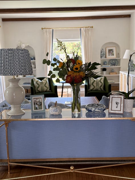 blue and white traditional home with fall accents