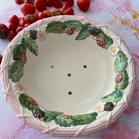 Vintage fruit strainer with strawberries