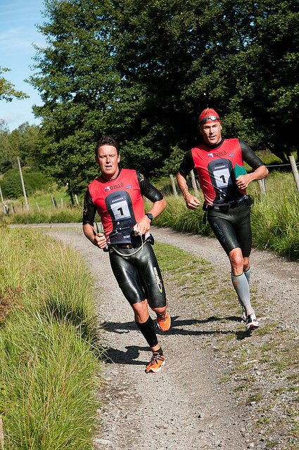 A couple of men running on a dirt road

AI-generated content may be incorrect.