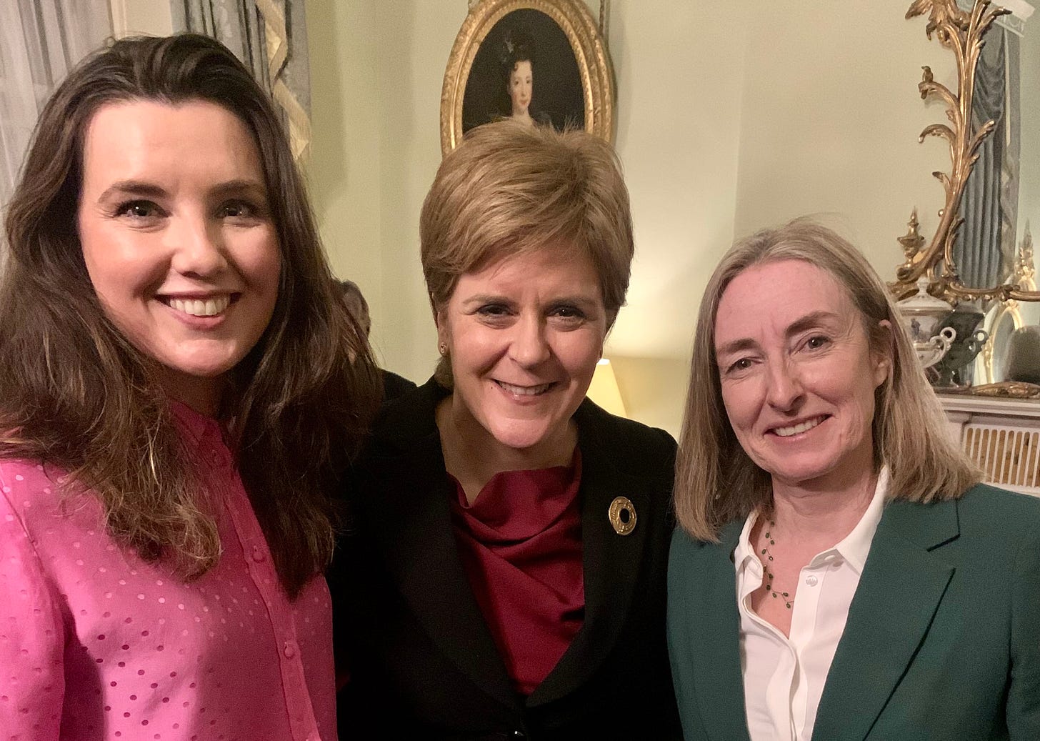 The image is a photo of Sarah Ronald, Nicola Sturgeon and Ana Stewart