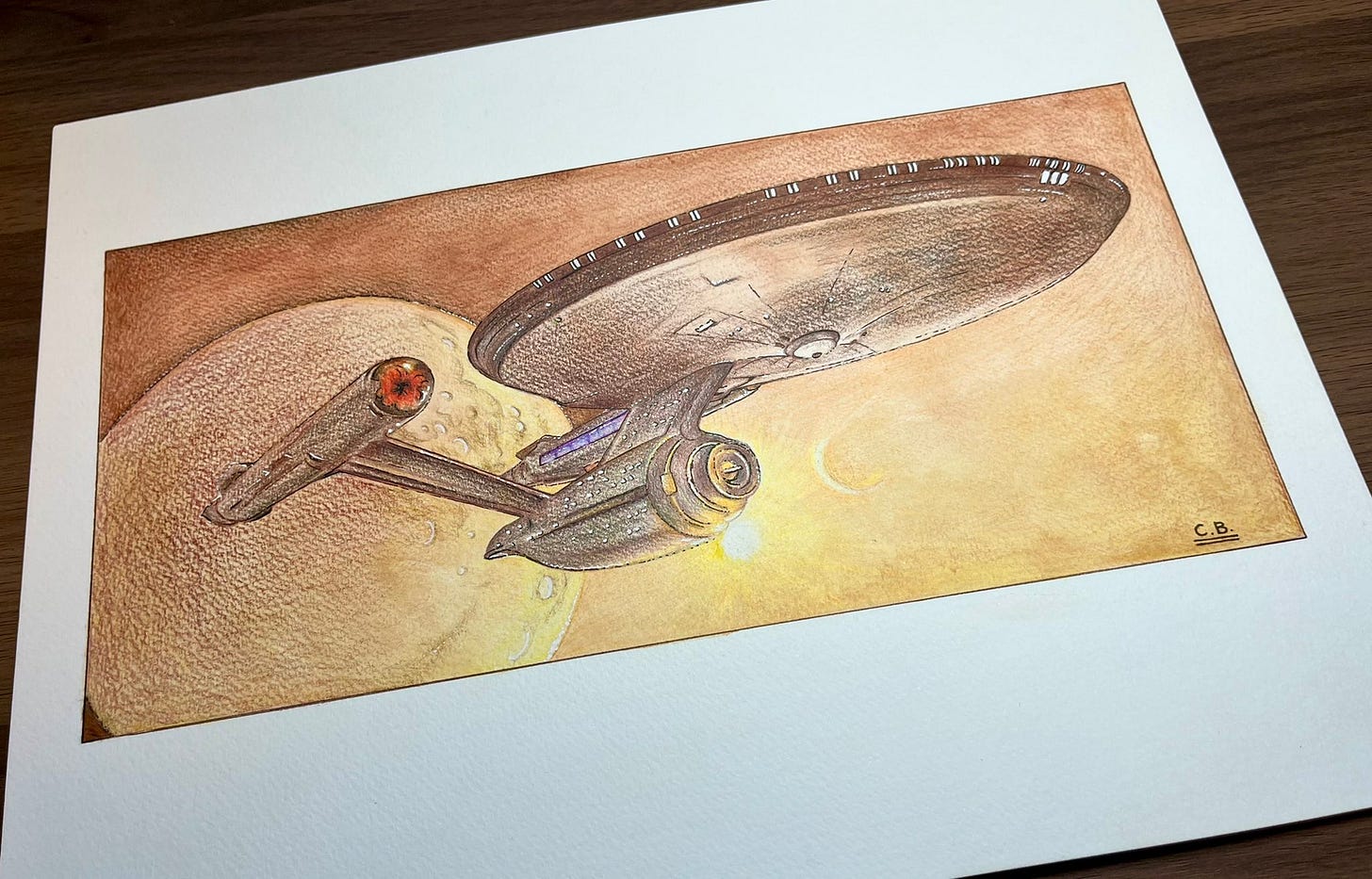 Pencil drawing of the Star Trek Enterprise A against an orange/brown background