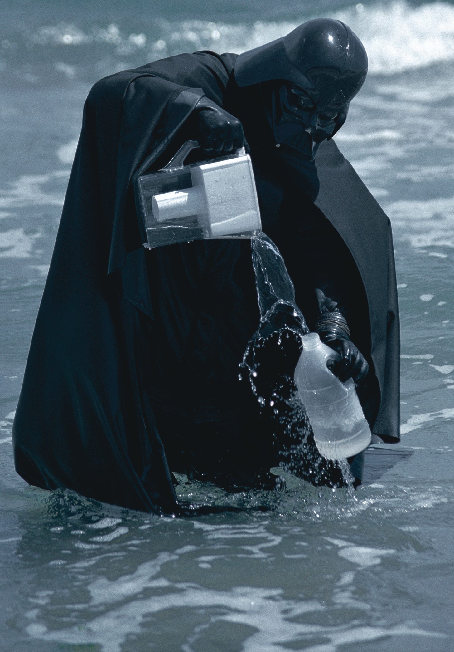 Darth Vader filling a plastic bottle with sea water