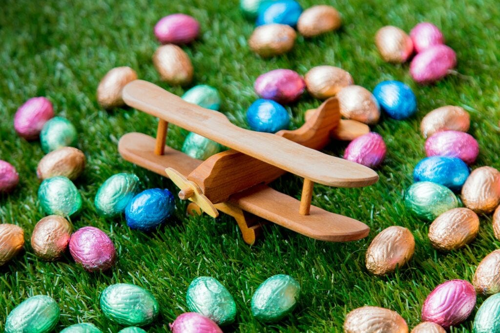color Chocolate Easter eggs and wooden airplane color Chocolate Easter eggs and wooden airplane