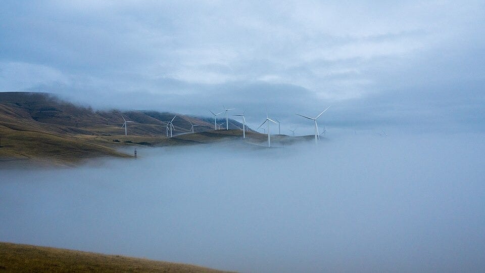 Image shows wind turbines on a foggy hillside in the Columbia Gorge. Taken between Maryhill and Goldendale in Washington.