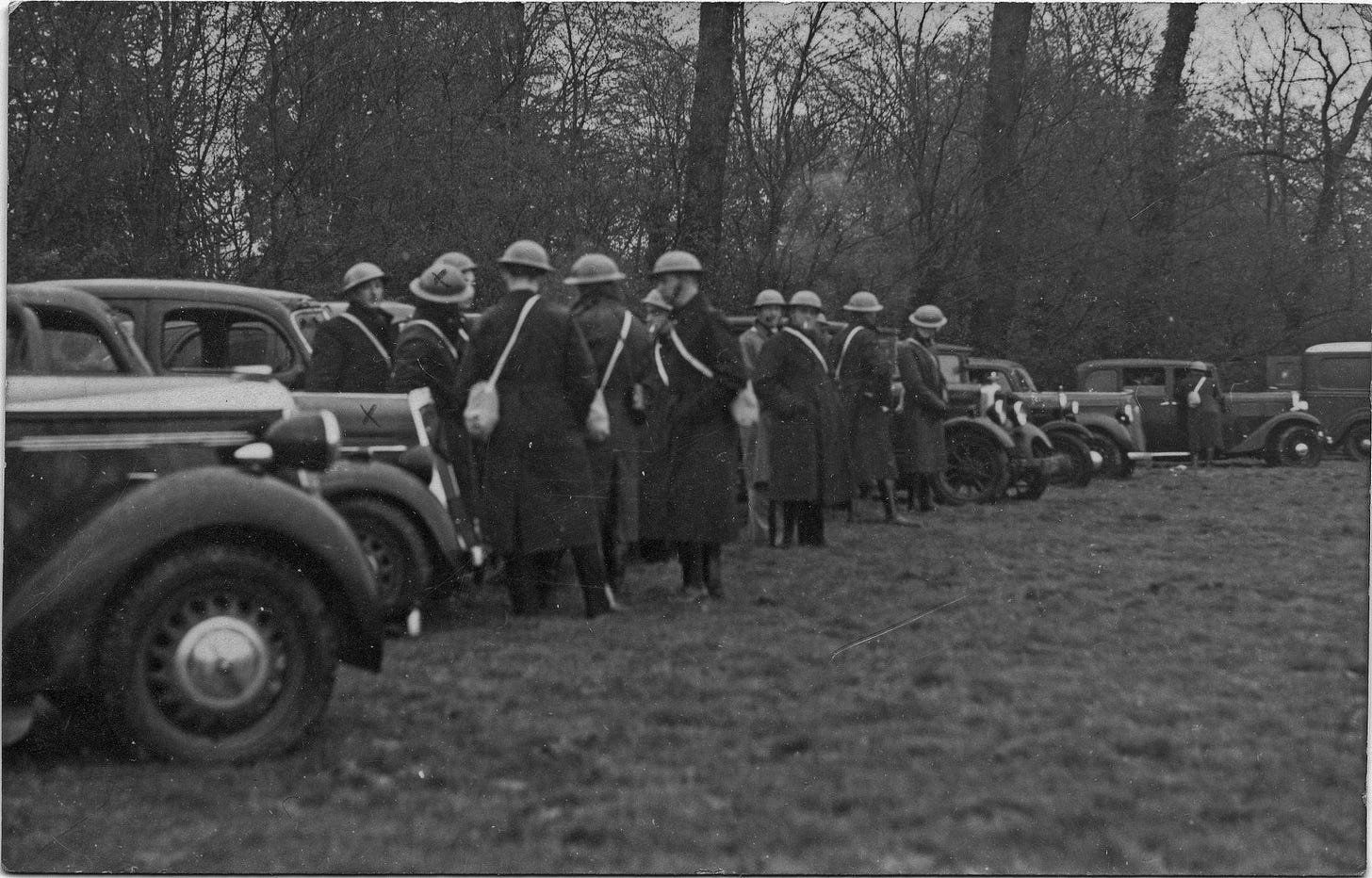 National Auxiliary Transport Corps members assemble by their cars.