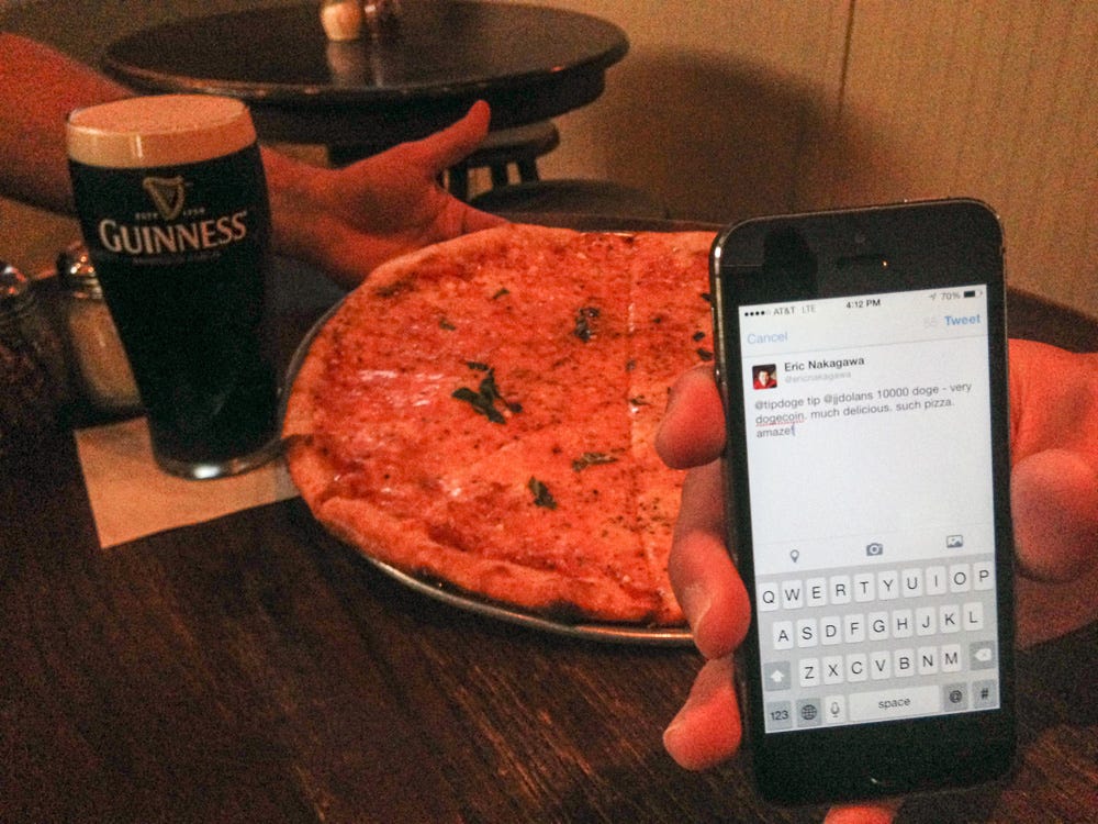 Paying for Pizza with DogeCoins | Courtesy Eric Nakagawa Paying for Pizza with DogeCoins | Courtesy Eric Nakagawa