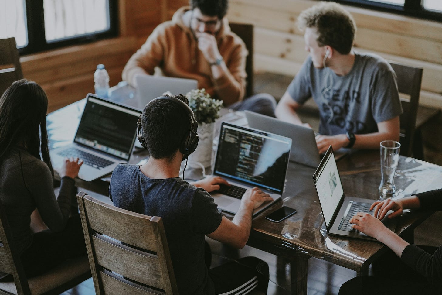 Group of young professionals working together on laptops around a shared table. Photo by Annie Spratt on Unsplash Group of young professionals working together on laptops around a shared table. Photo by Annie Spratt on Unsplash