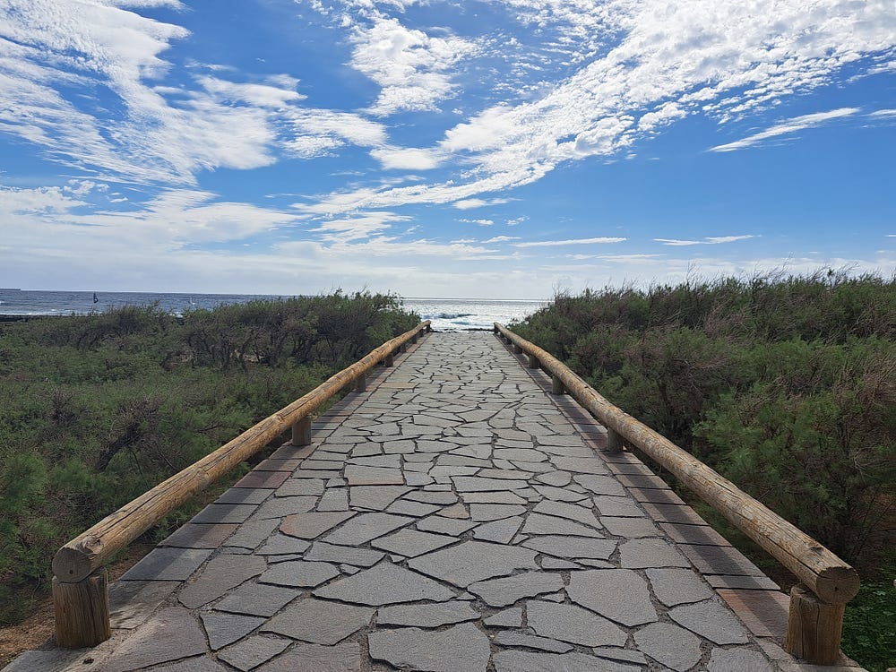 A path leading leading towards the sea.