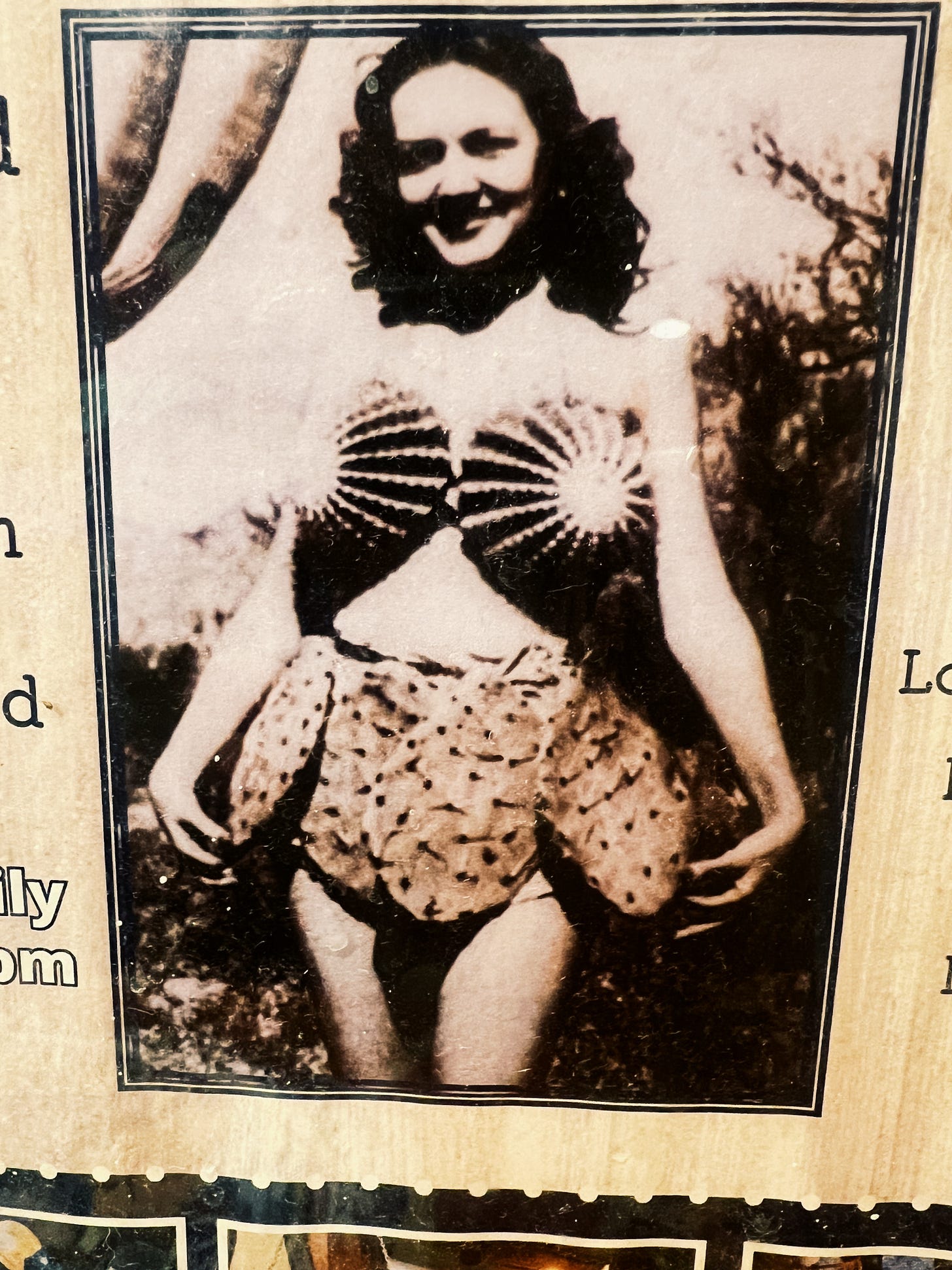 Photo of woman wearing a bra and skirt made from cactuses
