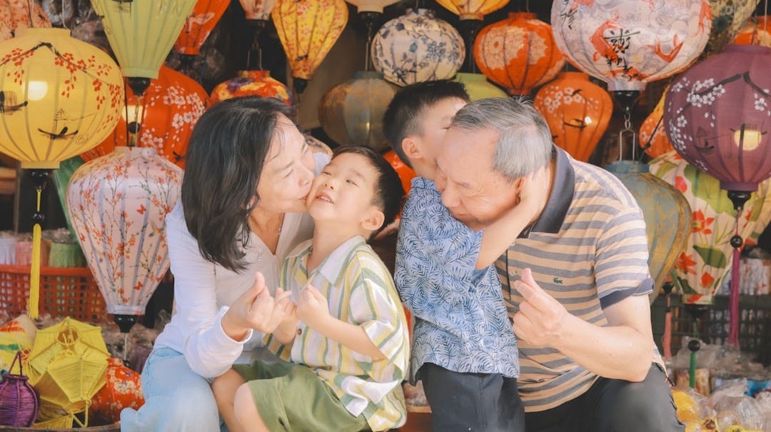 Family posing for a picture with lanterns Family posing for a picture with lanterns