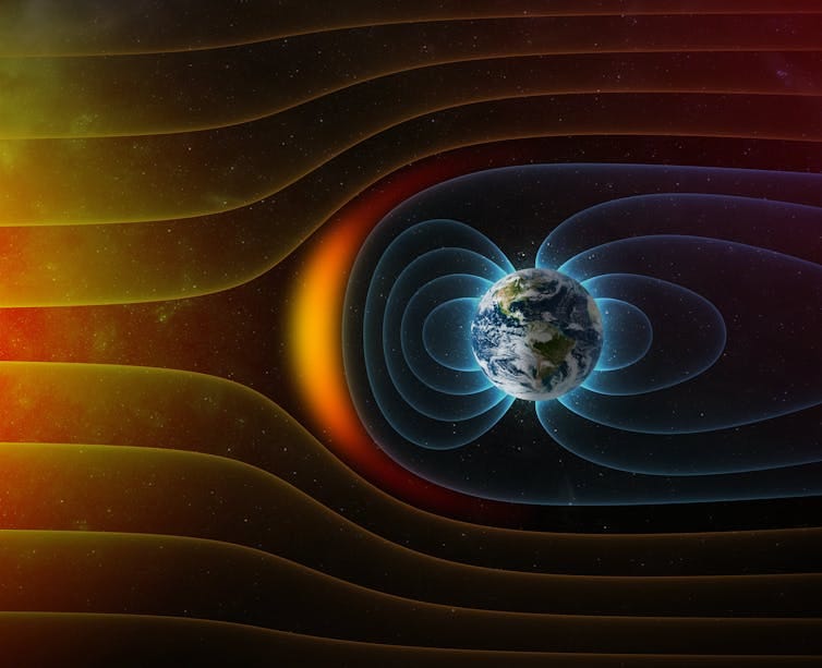 Diagram showing Earth surrounded by a bubble of blue lines deflecting a stream of orange lines