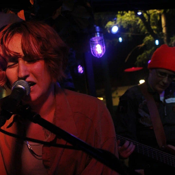 A gallery of people performing at queer open mics over the years