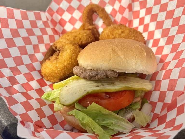 Burger and onion rings in basket at Sweden Creme in Mankato, Kansas