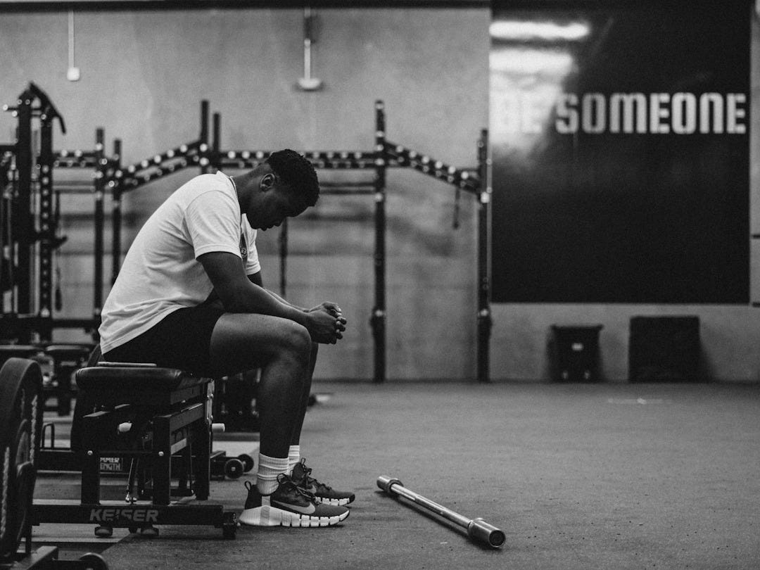 a man sitting in a wheelchair in a gym