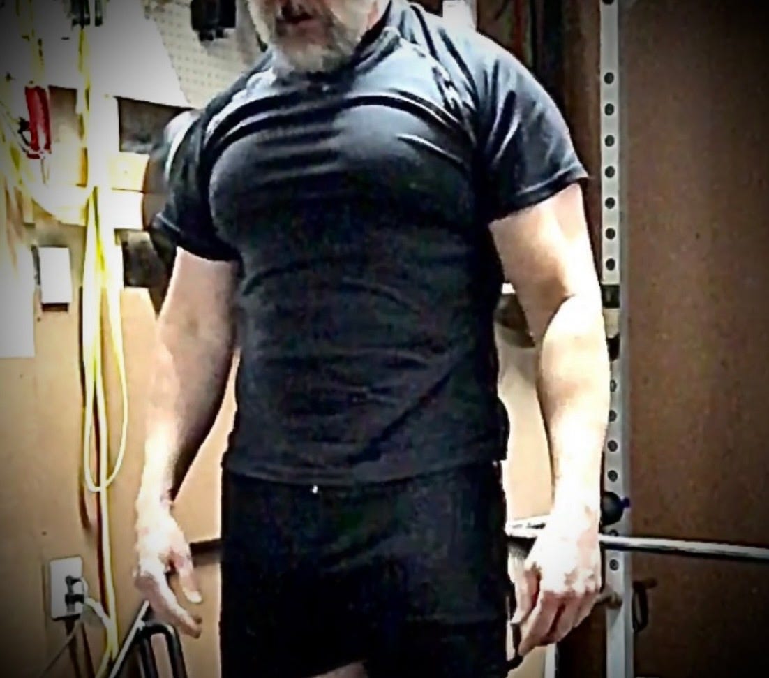 Larry Cornett lifting weights