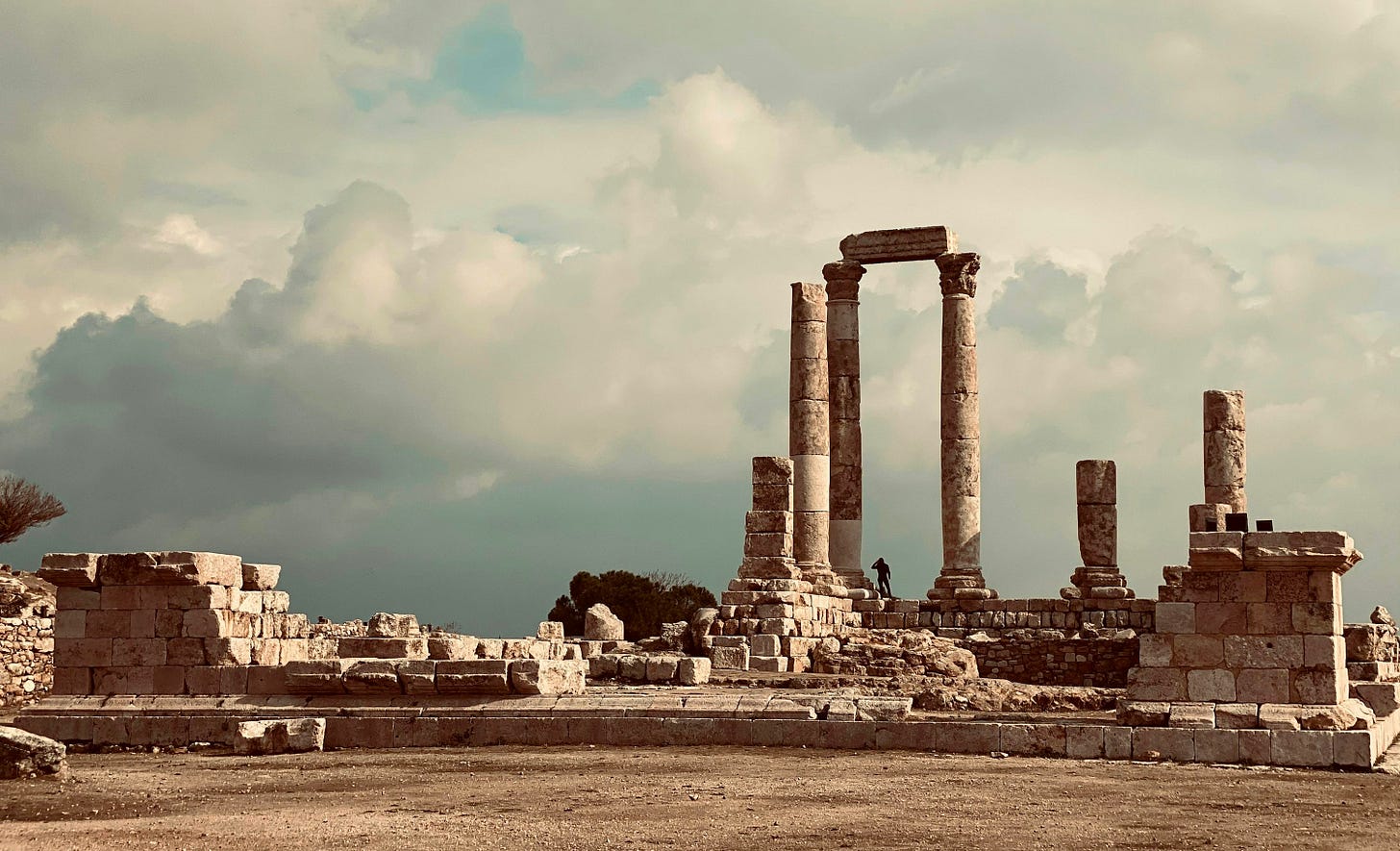 brown concrete building under white clouds during daytime brown concrete building under white clouds during daytime