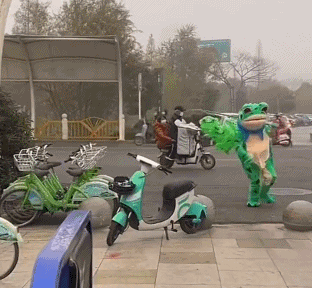 Street seller in frog costume running away from Chinese police Street seller in frog costume running away from Chinese police