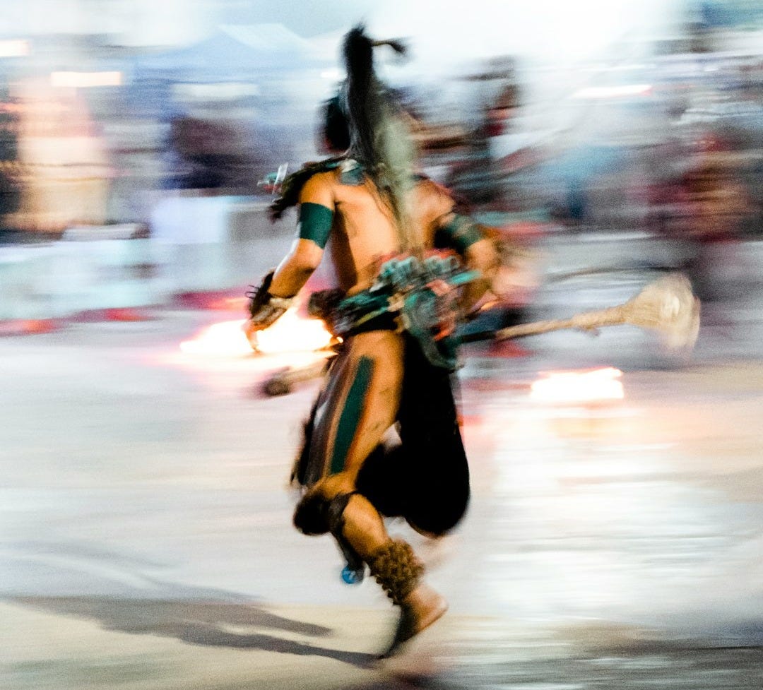 a blurry photo of a man in costume running a blurry photo of a man in costume running