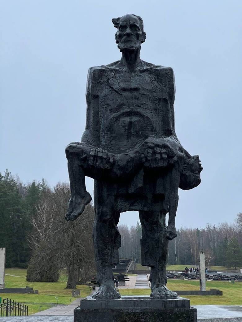 A statue of a person holding a person
AI-generated content may be incorrect. A statue of a person holding a person
AI-generated content may be incorrect.